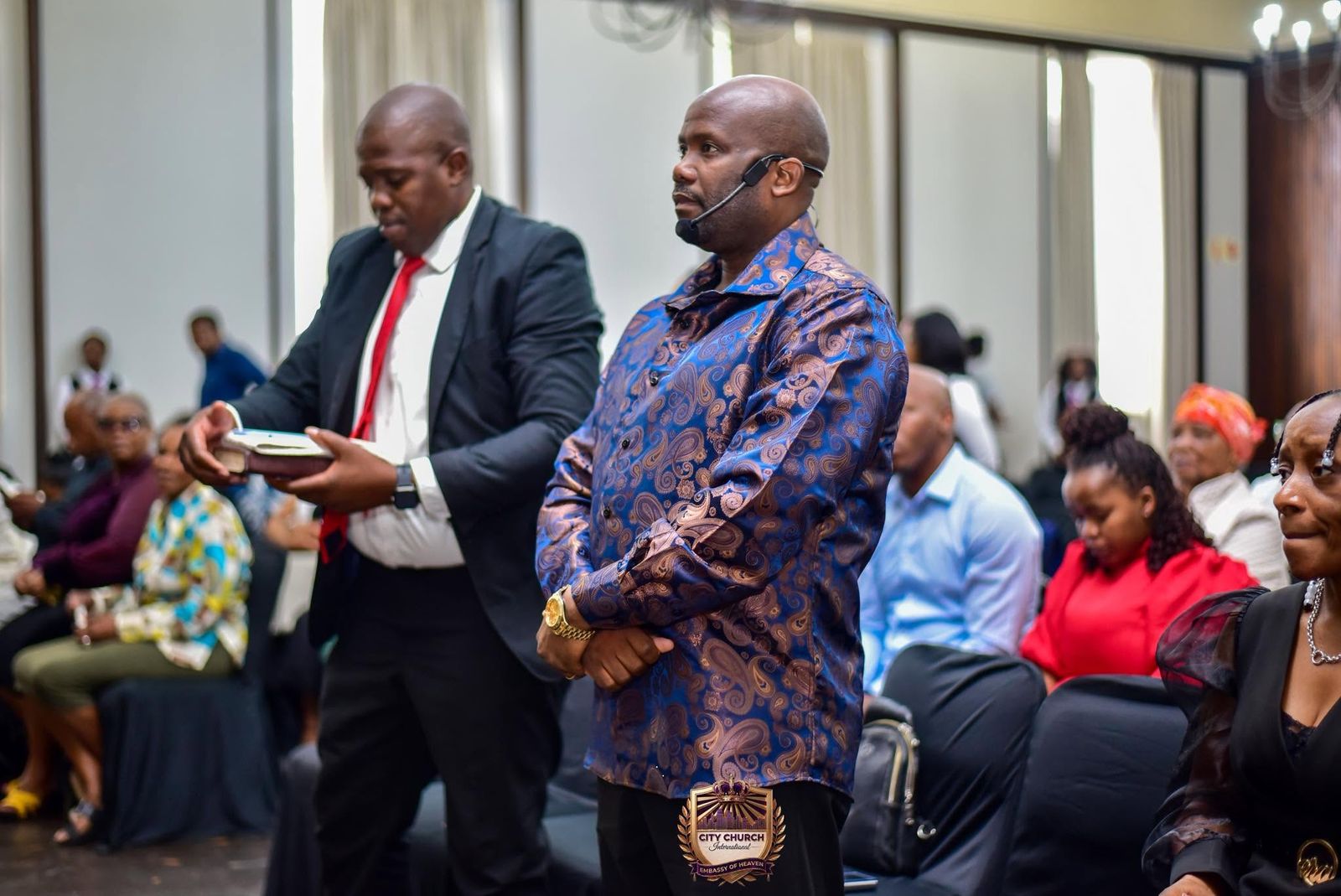 Ministers standing during the service