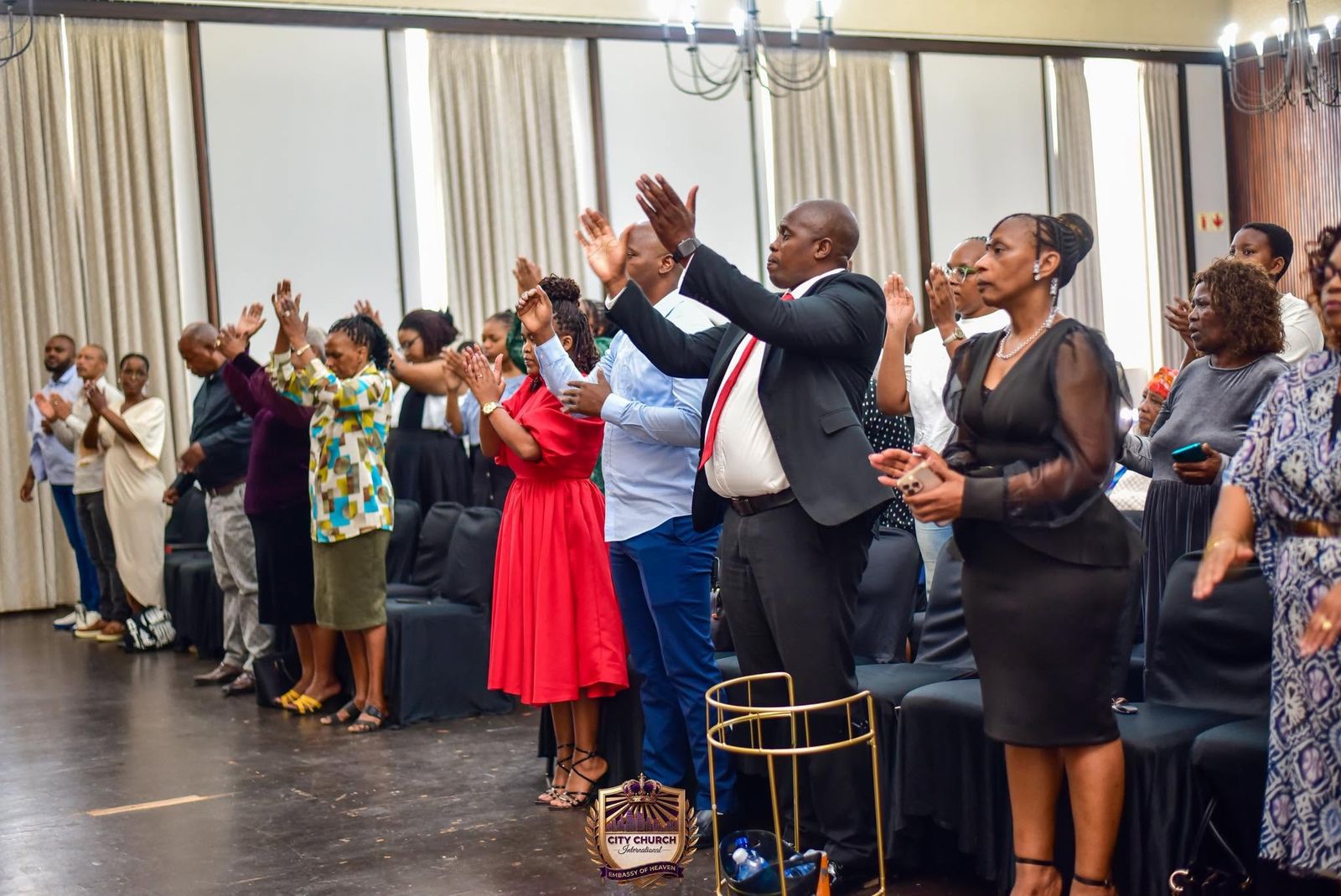 Members lifting their hands in worship
